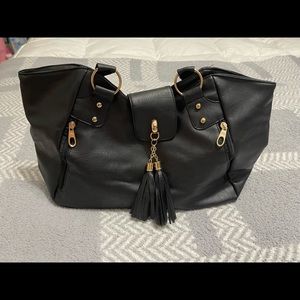 Black NWOT vegan leather handbag with tassel